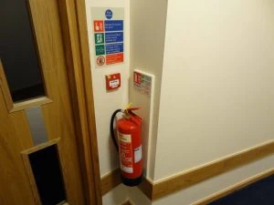 Fire extinguisher with ID sign and fire action sign
